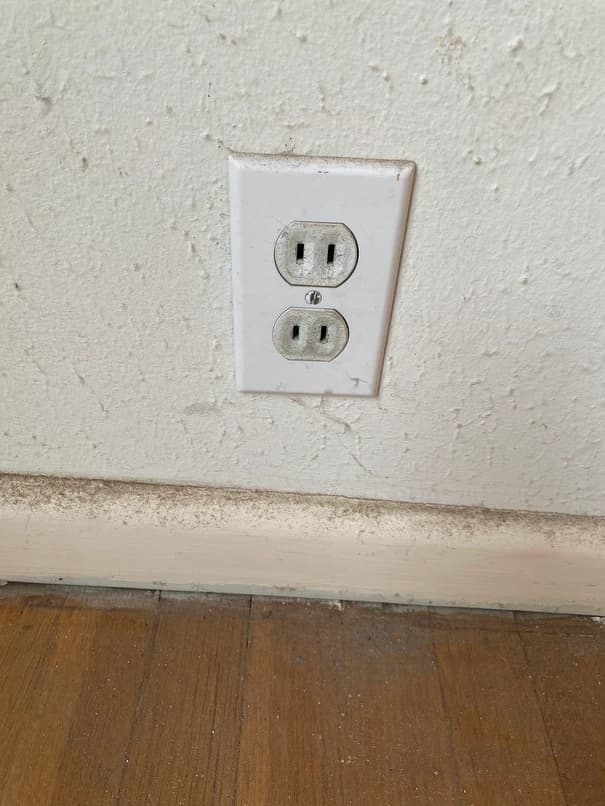 Two-prong outlet showing ungrounded wiring